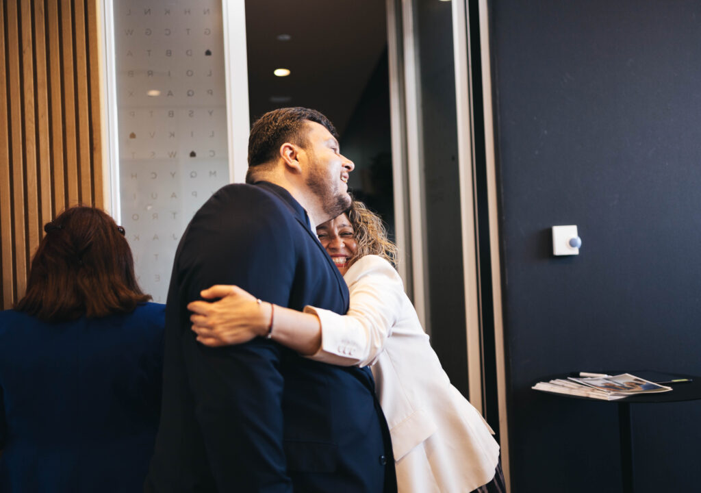 Veronica hugging a Member